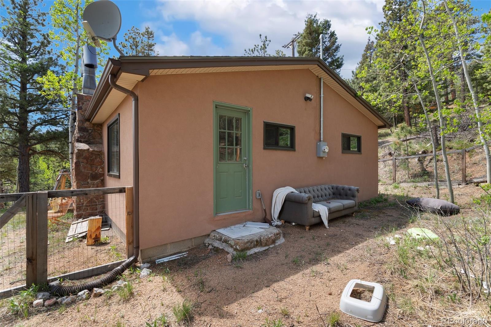 6230 Waterfall Loop Manitou Springs, CO 80829 - Photo 20 of 23 a backyard of a house with yard fire pit and outdoor seating