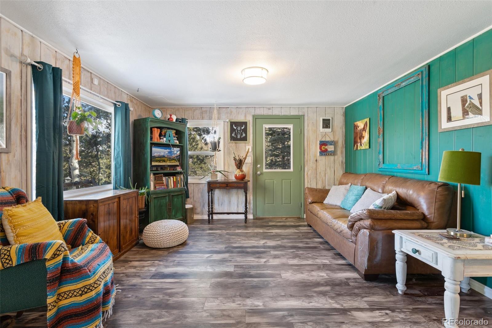 6230 Waterfall Loop Manitou Springs, CO 80829 - Photo 6 of 23 a living room with furniture and a large window