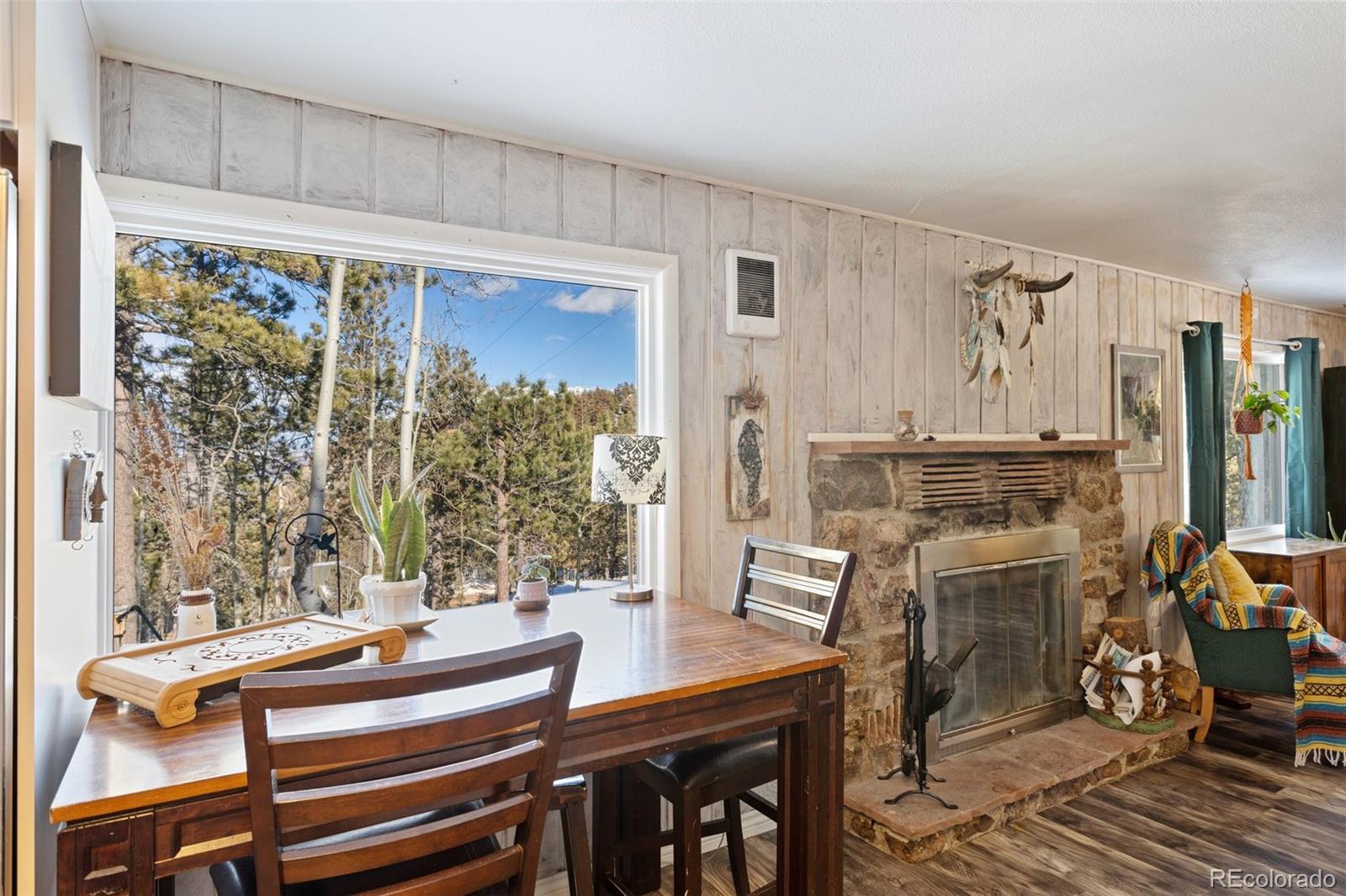 6230 Waterfall Loop Manitou Springs, CO 80829 - Photo 10 of 23 a view of a dining room with furniture window and outside view