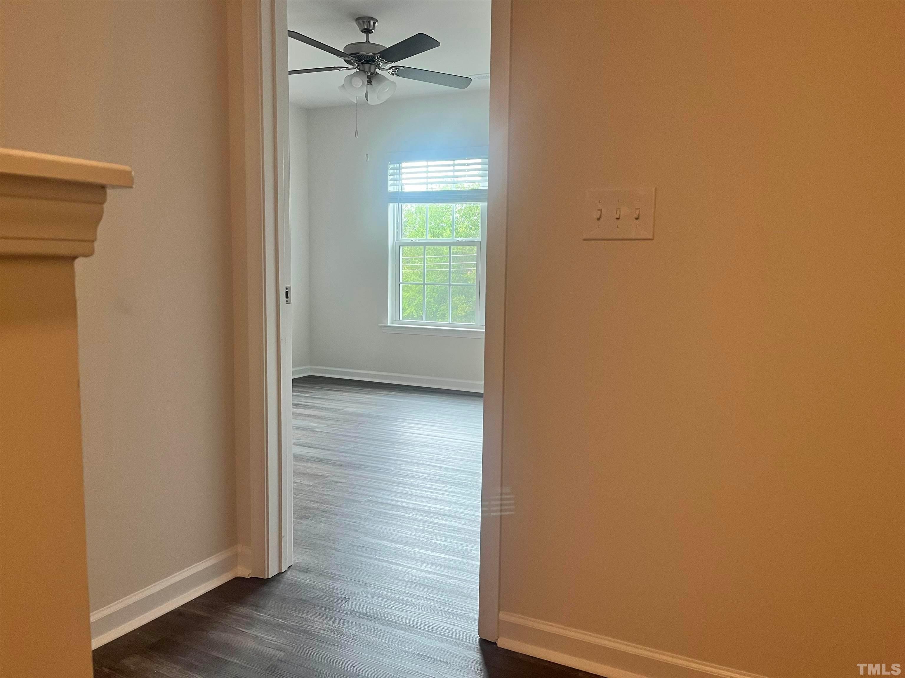 5018 Jayden Drive Durham, NC 27704 - Photo 17 of 22 a view of an empty room with wooden floor and a window