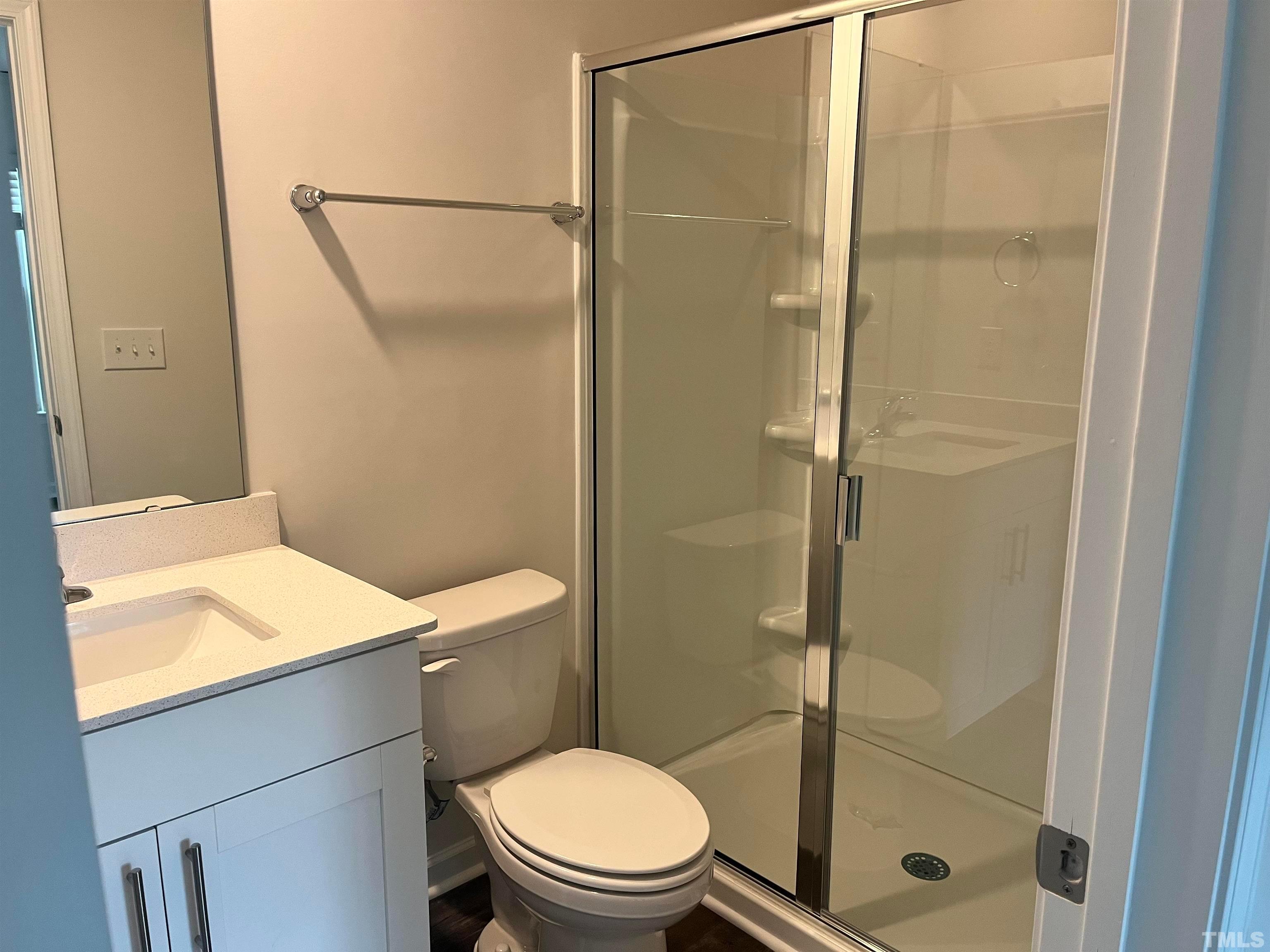 5018 Jayden Drive Durham, NC 27704 - Photo 18 of 22 a bathroom with a shower and a toilet