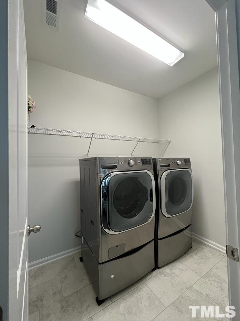 5018 Jayden Drive Durham, NC 27704 - Photo 21 of 22 a utility room with dryer and washer