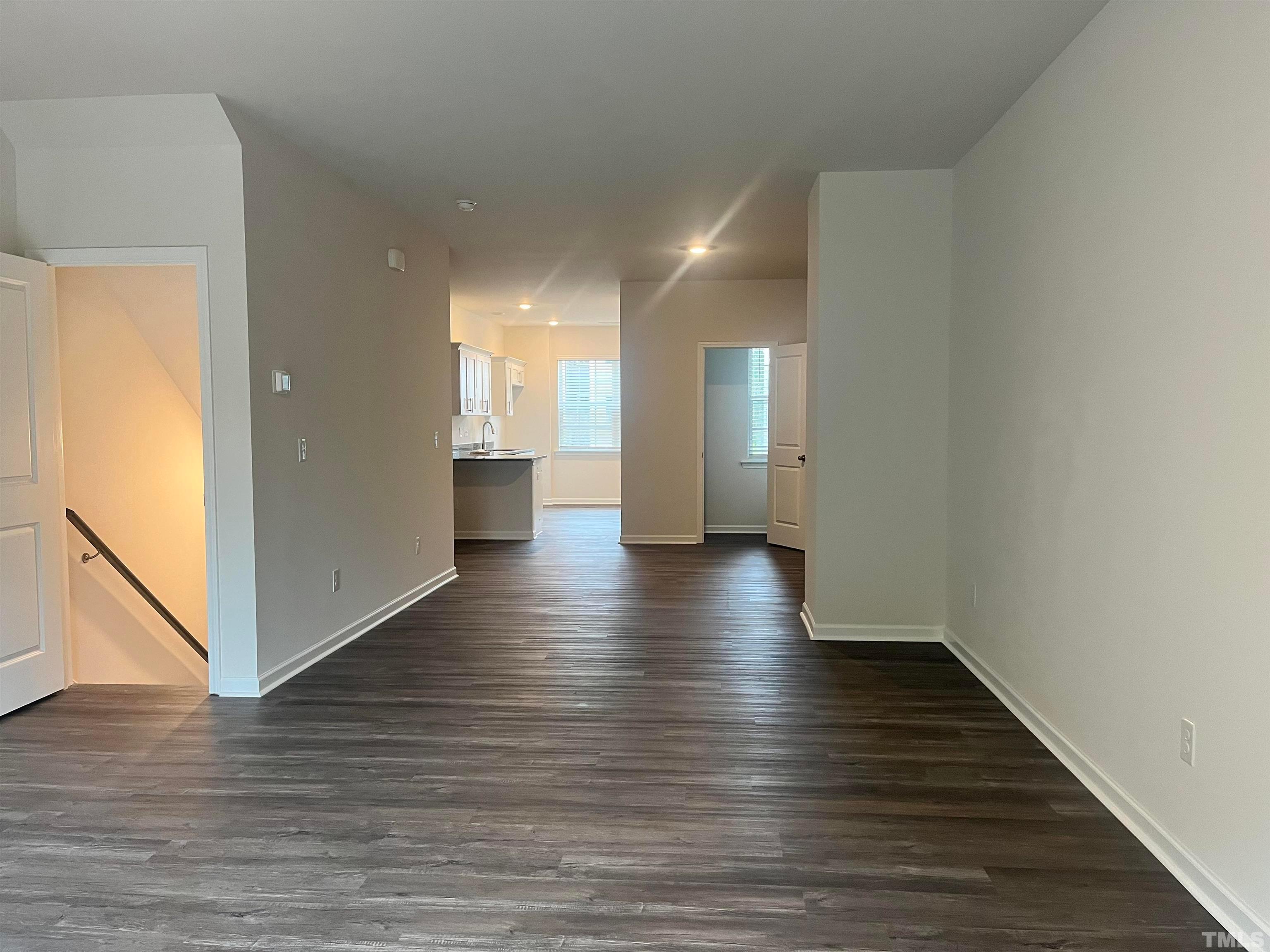 5018 Jayden Drive Durham, NC 27704 - Photo 7 of 22 a view of a hallway with wooden floor