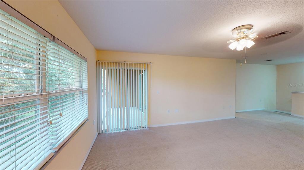 4600 East Moody Boulevard, Unit 5N Bunnell, FL 32110 - Photo 12 of 44 a view of an empty room with a window