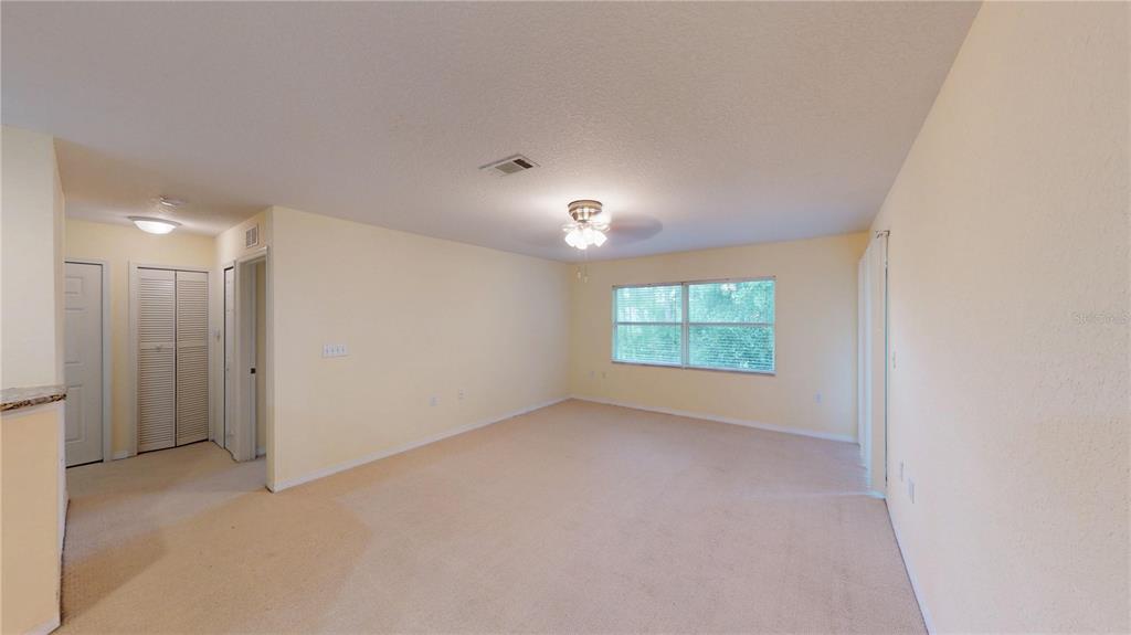 4600 East Moody Boulevard, Unit 5N Bunnell, FL 32110 - Photo 14 of 44 an empty room with windows and closet