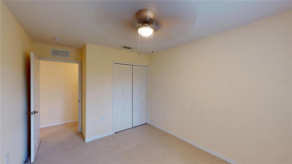 4600 East Moody Boulevard, Unit 5N Bunnell, FL 32110 - Photo 18 of 44 an empty room with window and closet