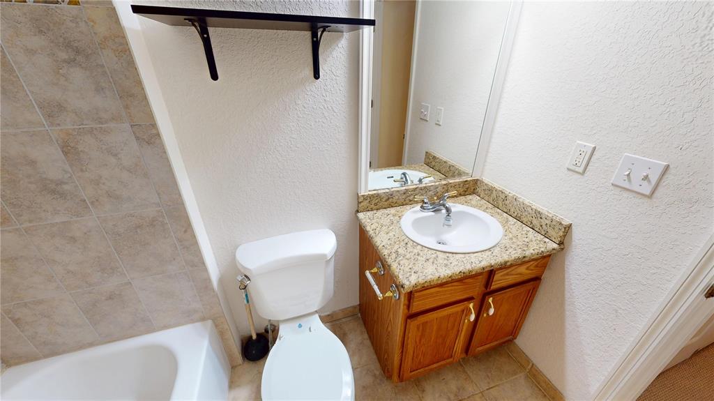 4600 East Moody Boulevard, Unit 5N Bunnell, FL 32110 - Photo 20 of 44 a bathroom with a sink toilet and shower