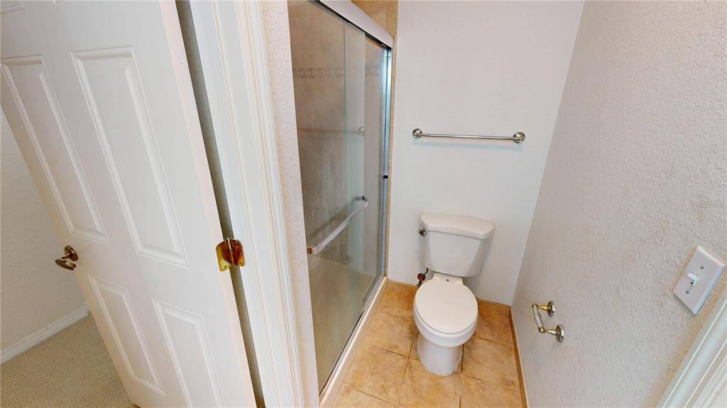 4600 East Moody Boulevard, Unit 5N Bunnell, FL 32110 - Photo 26 of 44 a white toilet sitting next to a small sink