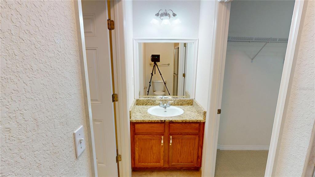 4600 East Moody Boulevard, Unit 5N Bunnell, FL 32110 - Photo 28 of 44 a bathroom with a sink and a mirror