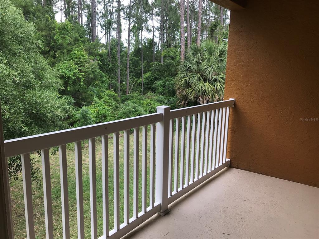 4600 East Moody Boulevard, Unit 5N Bunnell, FL 32110 - Photo 32 of 44 a view of a balcony with outdoor space