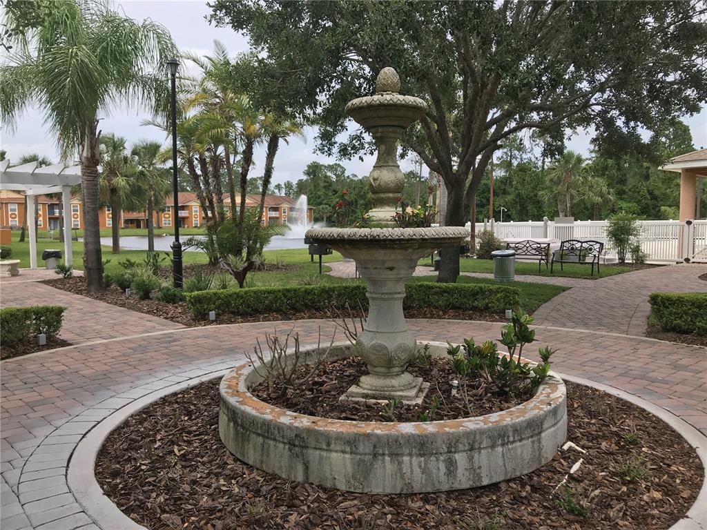4600 East Moody Boulevard, Unit 5N Bunnell, FL 32110 - Photo 35 of 44 a view of a swimming pool with a patio and a yard