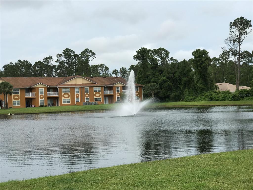 4600 East Moody Boulevard, Unit 5N Bunnell, FL 32110 - Photo 38 of 44 a view of building with river in front of it