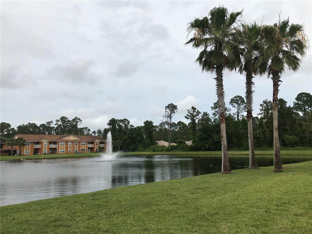 4600 East Moody Boulevard, Unit 5N Bunnell, FL 32110 - Photo 39 of 44 a view of a lake with houses