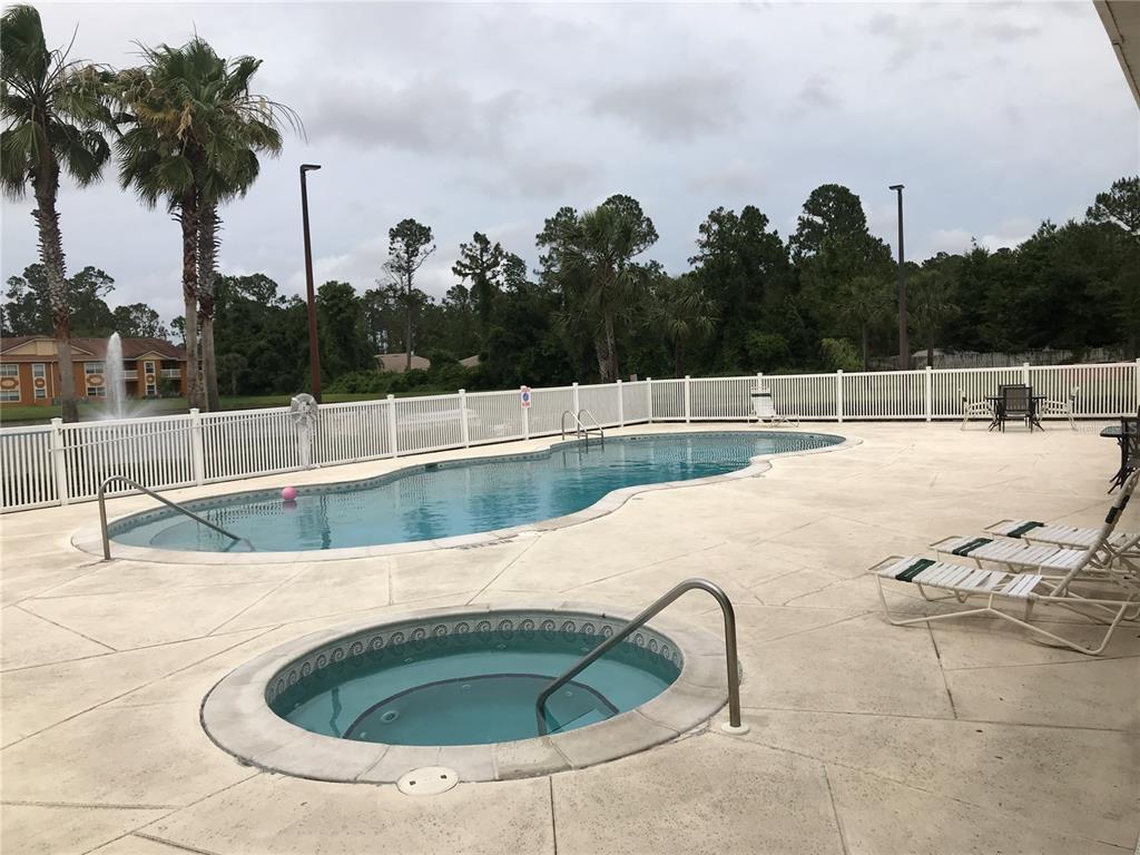 4600 East Moody Boulevard, Unit 5N Bunnell, FL 32110 - Photo 40 of 44 a view of outdoor space and swimming pool