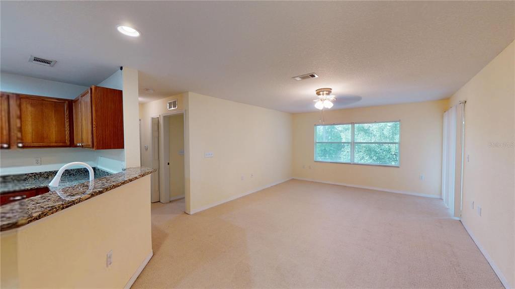 4600 East Moody Boulevard, Unit 5N Bunnell, FL 32110 - Photo 4 of 44 a view of a kitchen with a sink cabinets and a window