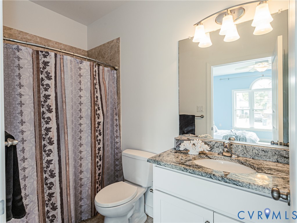 2018 Valentine Road Henrico, VA 23228 - Photo 27 of 65 a bathroom with a granite countertop sink toilet and shower