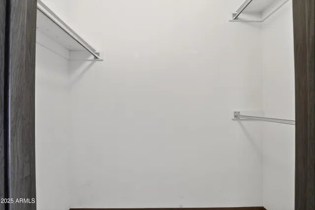 a view of a livingroom with wooden cabinets