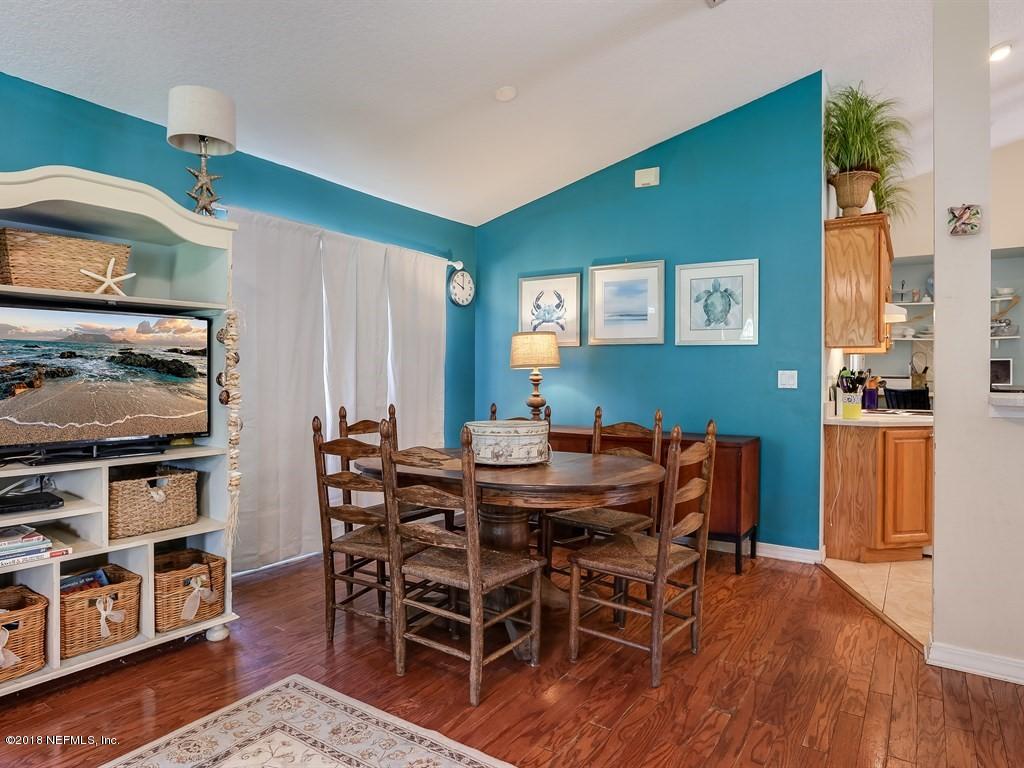 907 Alicante Road St. Augustine, FL 32086 - Photo 3 of 21 a view of a dining room with furniture and wooden floor