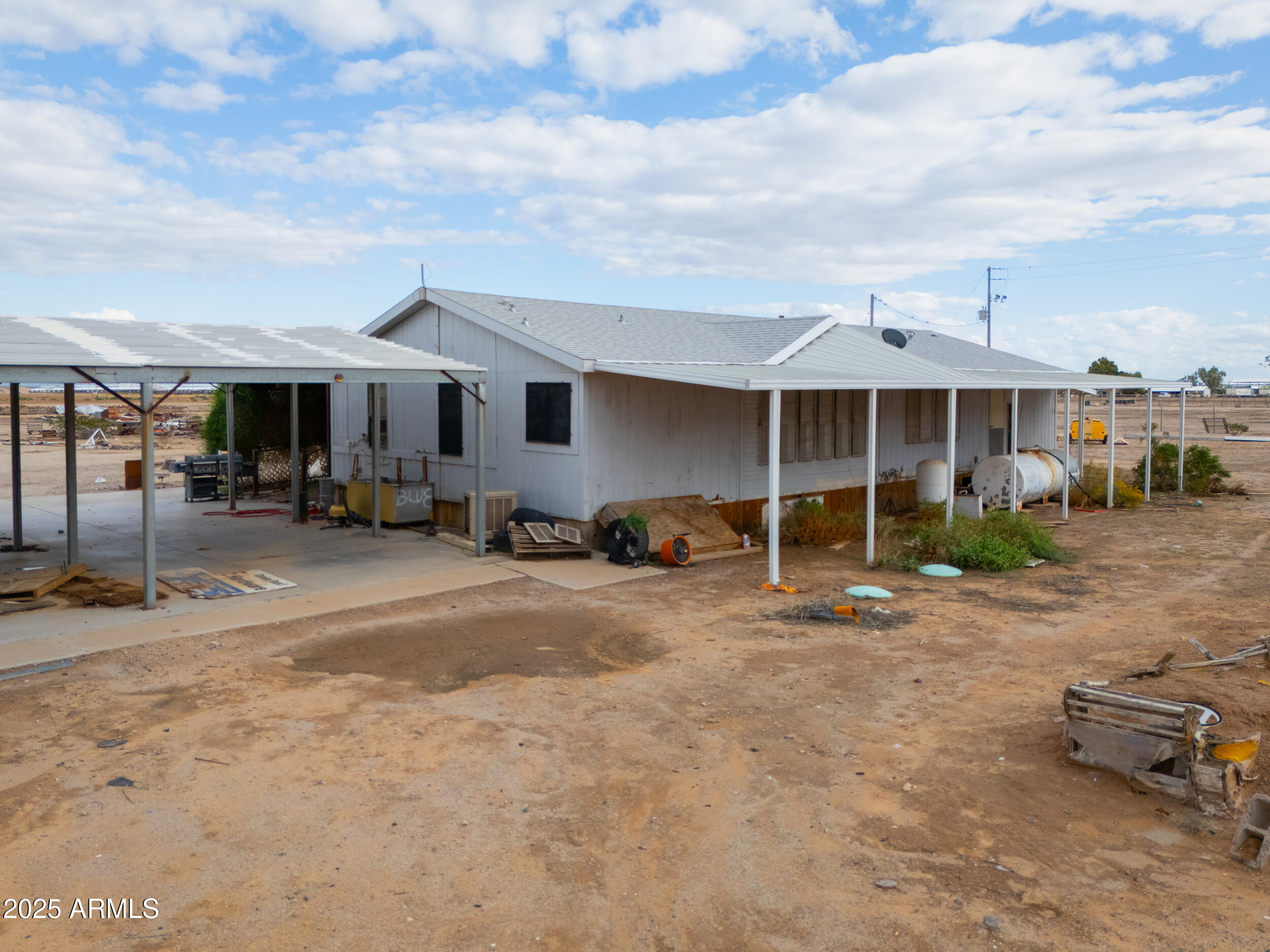 20678 North Warren Road Maricopa, AZ 85139 - Photo 29 of 31 a view of a chair and table in the backyard