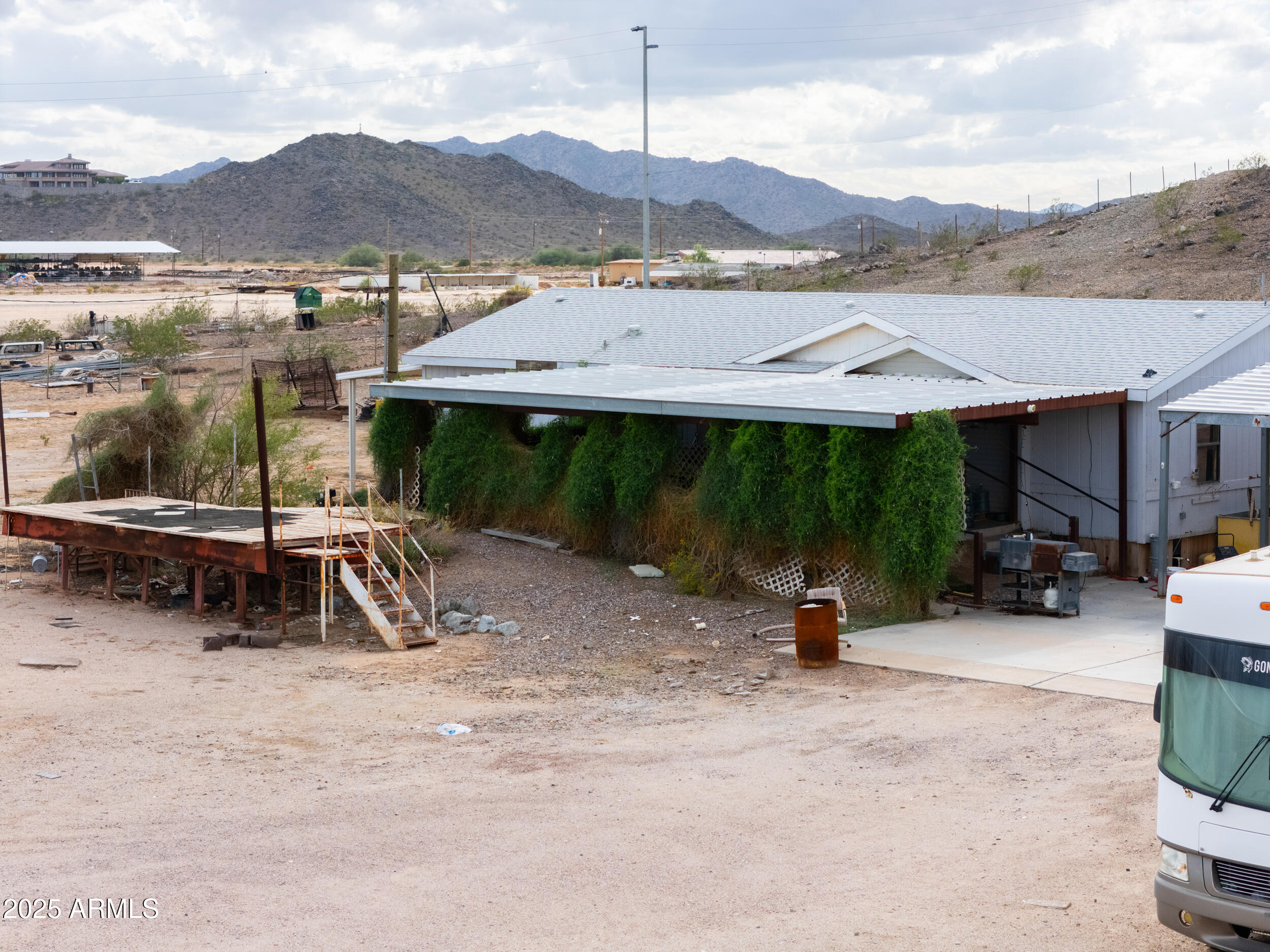 20678 North Warren Road Maricopa, AZ 85139 - Photo 31 of 31 a view of a patio with a table and chairs
