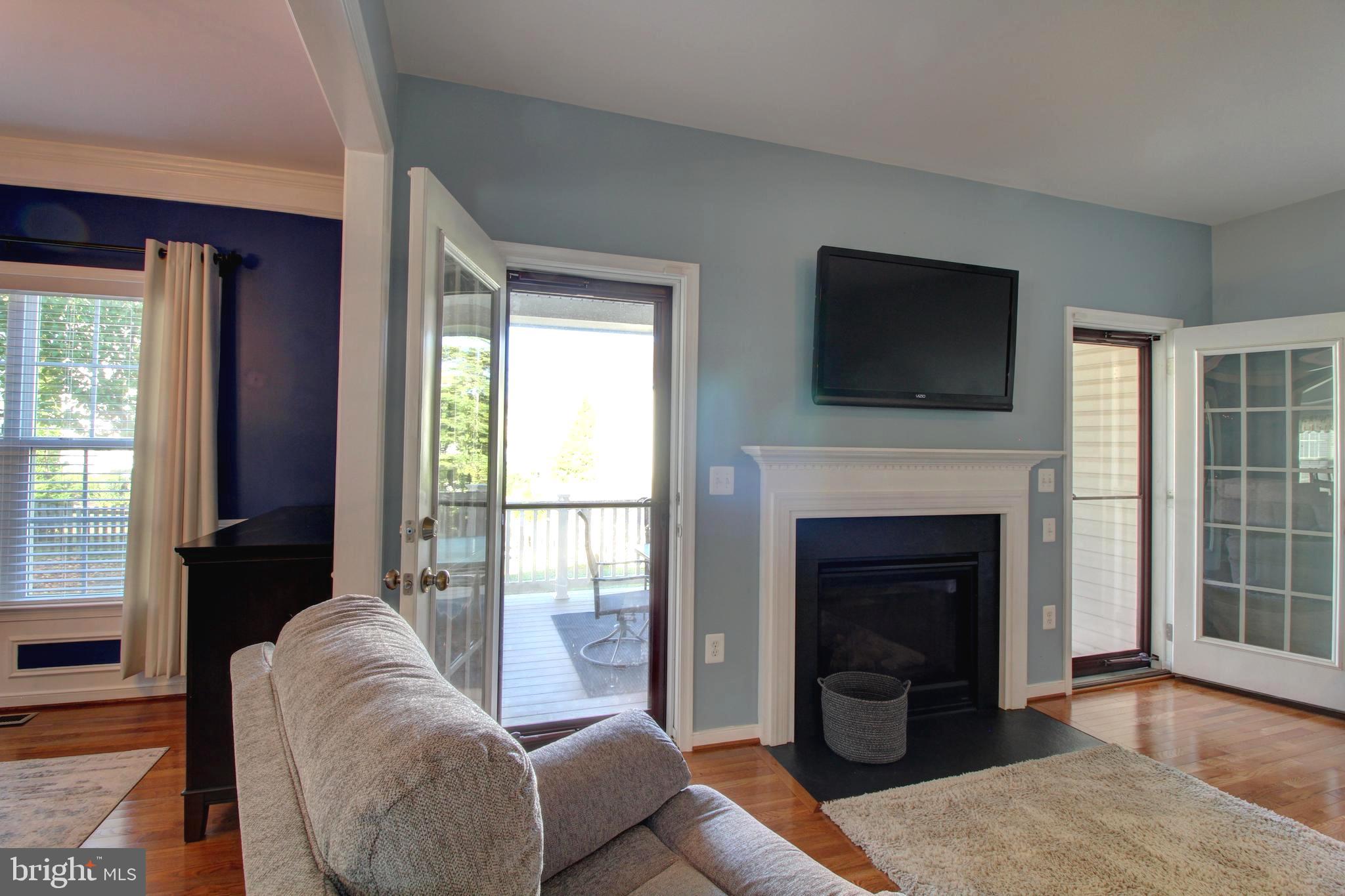 916 Augustine Drive Culpeper, VA 22701 - Photo 5 of 69 Cozy gas fireplace and doors to covered porch