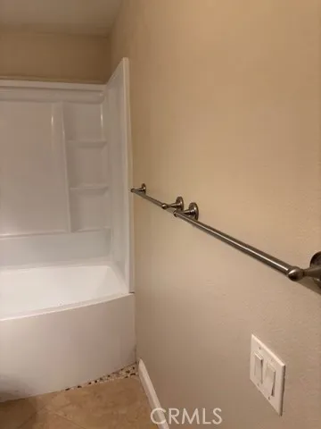 a bathroom with a shower and a bath tub