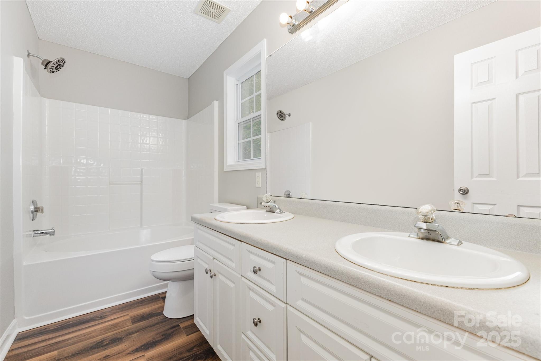 159 Scotch Pine Drive York, SC 29745 - Photo 13 of 28 a bathroom with a double vanity sink toilet mirror and bathtub