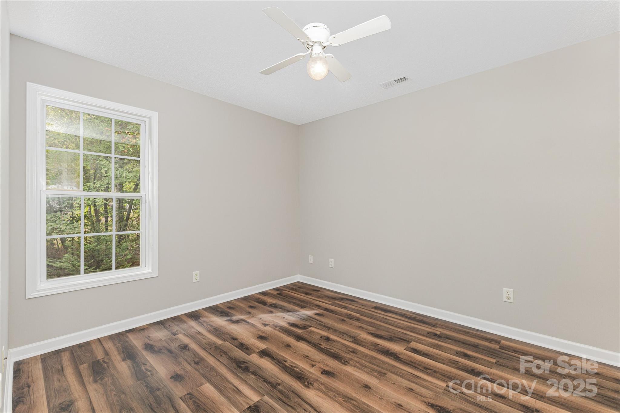 159 Scotch Pine Drive York, SC 29745 - Photo 19 of 28 an empty room with a window and a fan