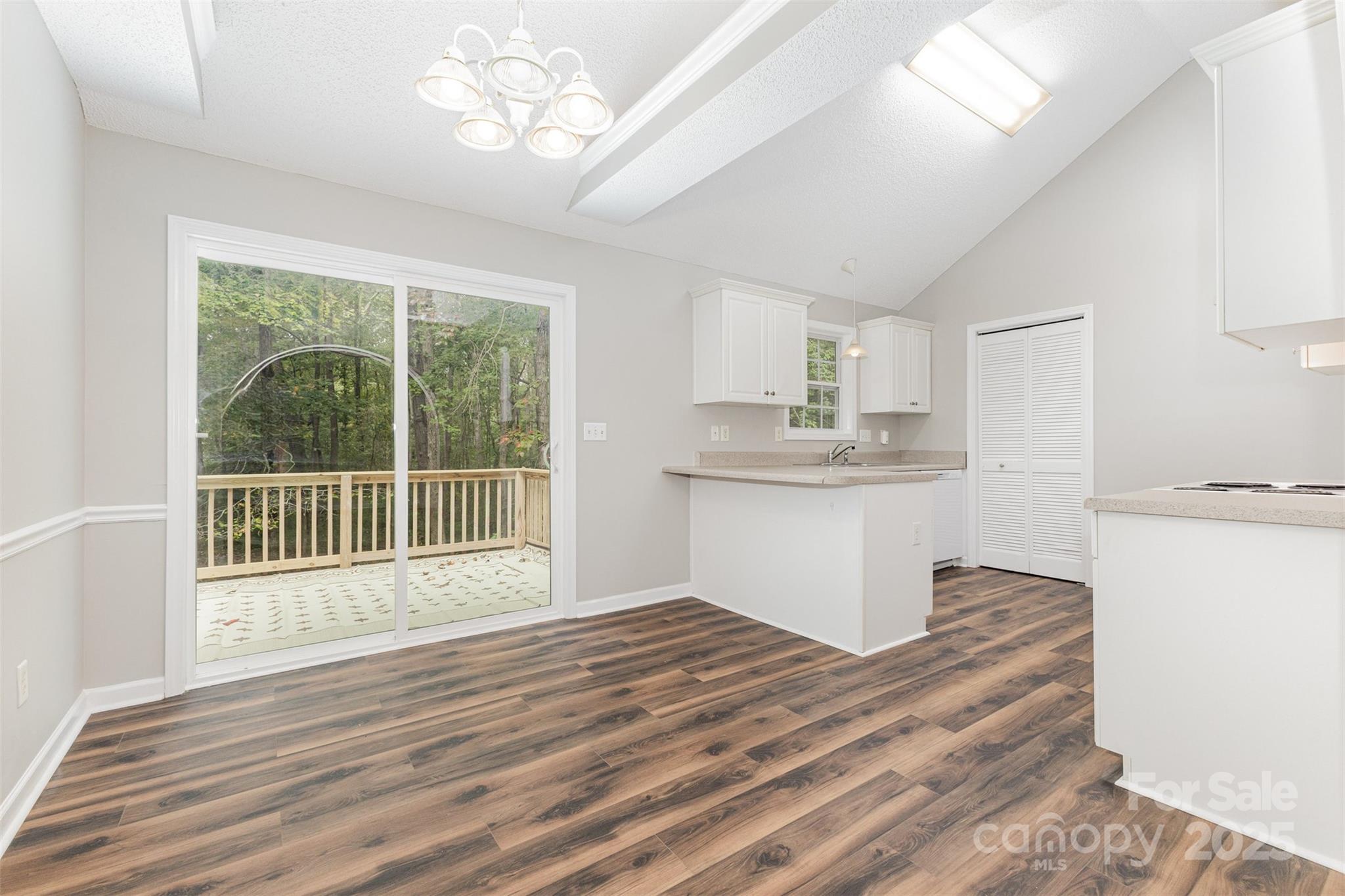 159 Scotch Pine Drive York, SC 29745 - Photo 6 of 28 a view of a kitchen with a dishwasher cabinets and wooden floor