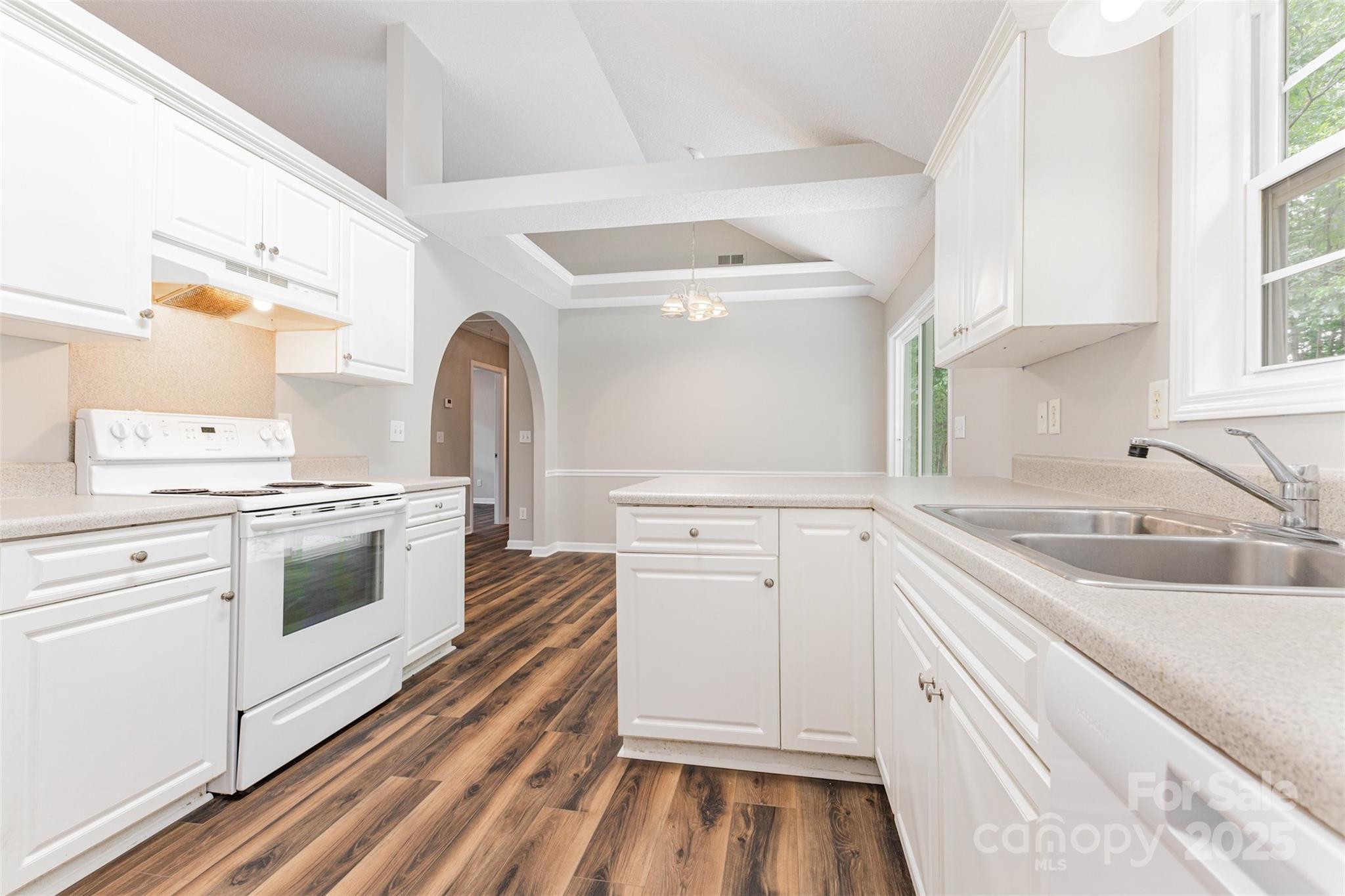 159 Scotch Pine Drive York, SC 29745 - Photo 7 of 28 a kitchen with white cabinets and white appliances