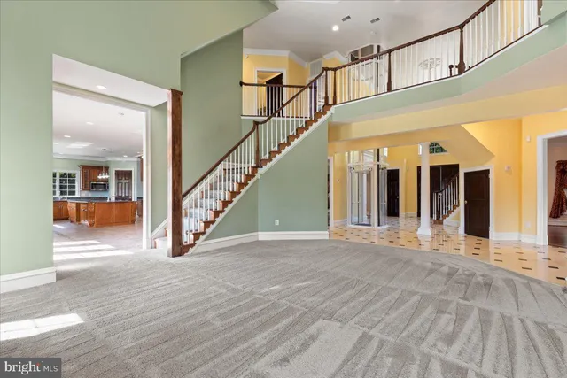 an open kitchen with granite countertop a sink and a large window