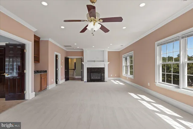 a bathroom with a granite countertop toilet sink and mirror