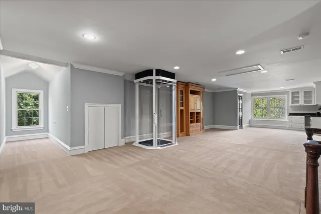 a view of a livingroom with furniture and a window
