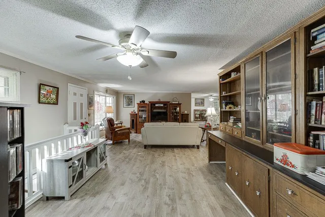 a view of a livingroom with furniture window and wooden floor