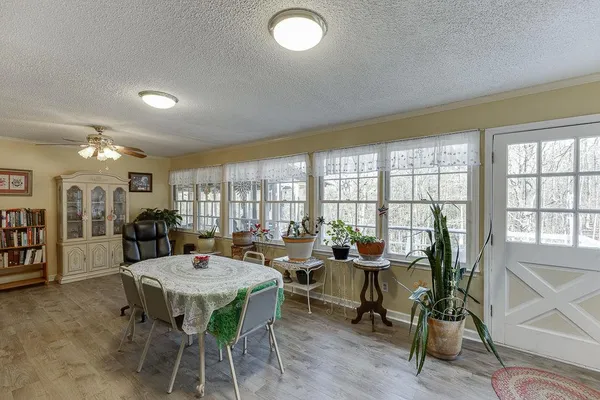 a view of a dining room with furniture and wooden floor