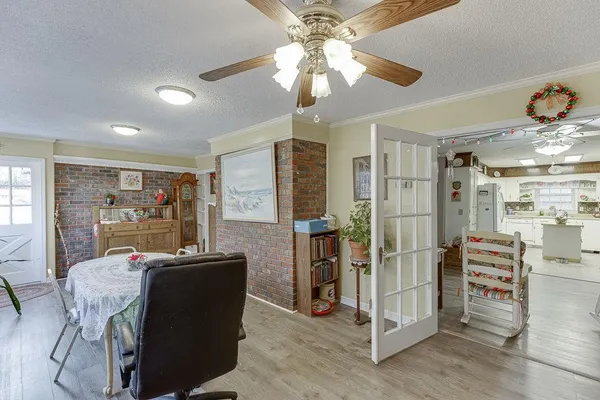 a kitchen with white cabinets and white appliances