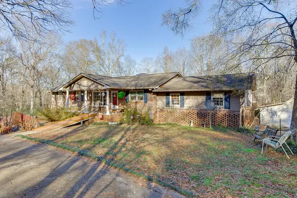 a view of a house with wooden fence