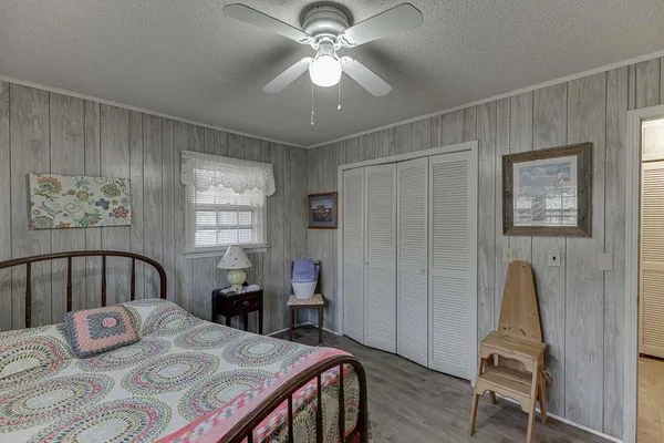 a bedroom with a bed and a dresser