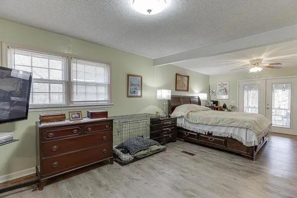 a bedroom with a bed and furniture
