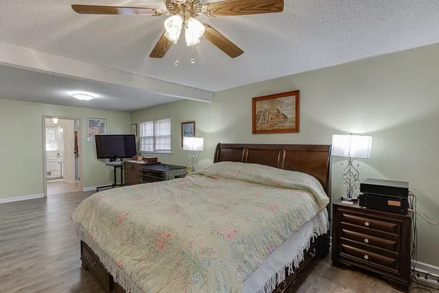 a bathroom with a double vanity sink a mirror and shower