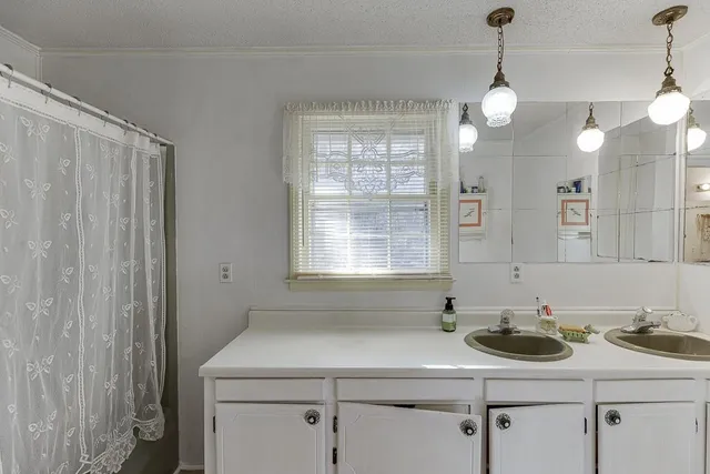 a living room with furniture a dining table and chairs with wooden floor
