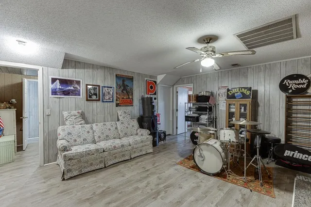 a bathroom with a sink toilet a mirror and shower