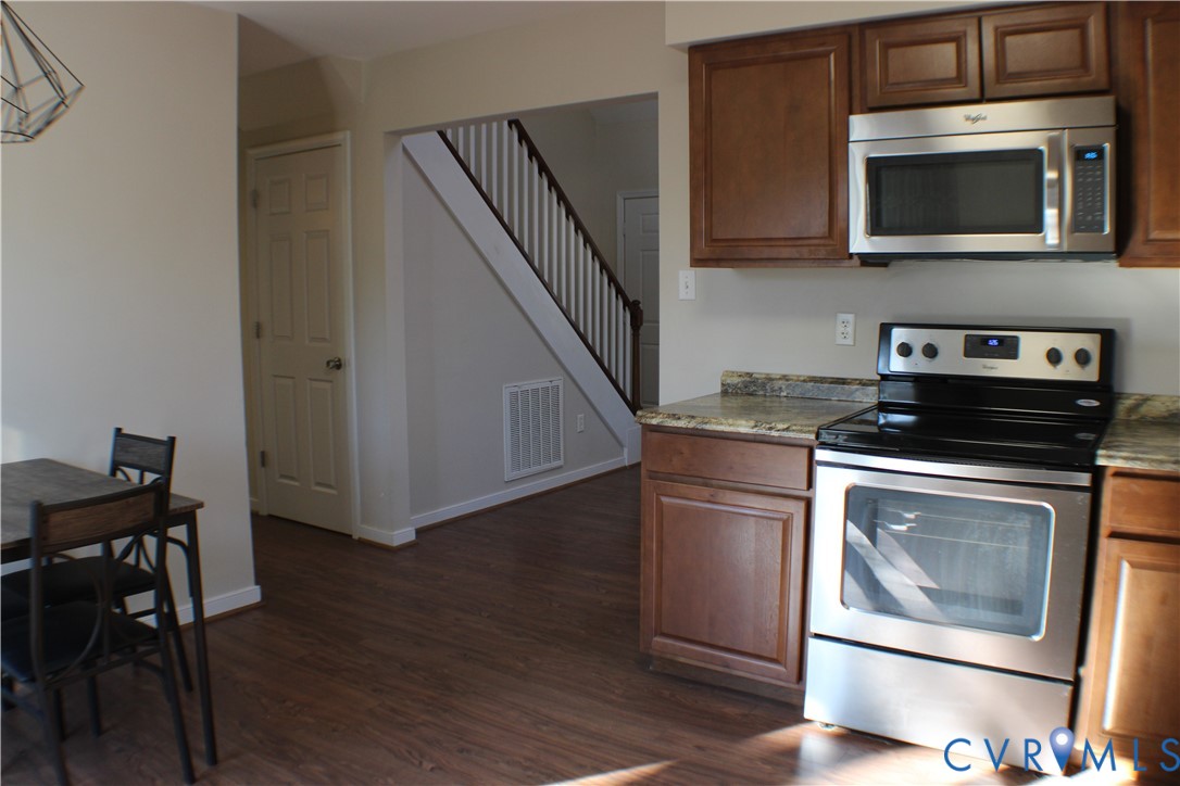 2929 South Ridge Drive Midlothian, VA 23112 - Photo 13 of 37 a kitchen with a stove microwave and sink