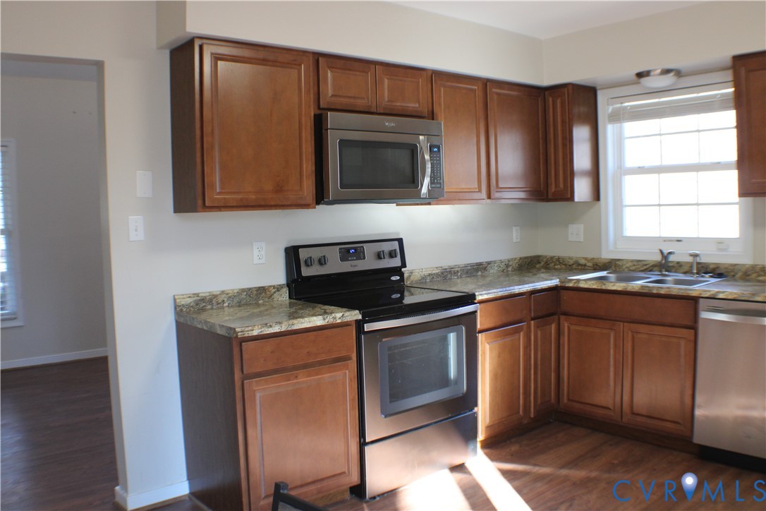 2929 South Ridge Drive Midlothian, VA 23112 - Photo 14 of 37 a kitchen with granite countertop cabinets stainless steel appliances and a sink