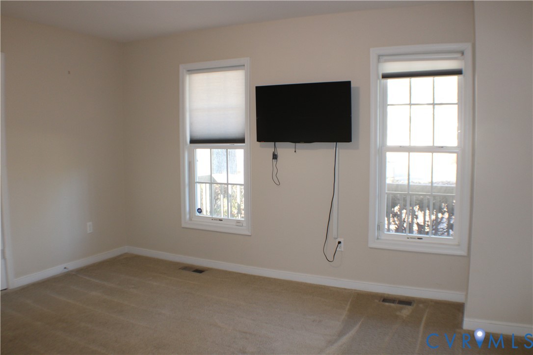 2929 South Ridge Drive Midlothian, VA 23112 - Photo 20 of 37 an empty room with windows