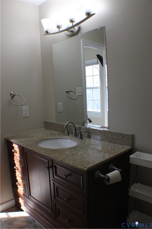 2929 South Ridge Drive Midlothian, VA 23112 - Photo 27 of 37 a bathroom with a granite countertop sink a toilet and with mirror