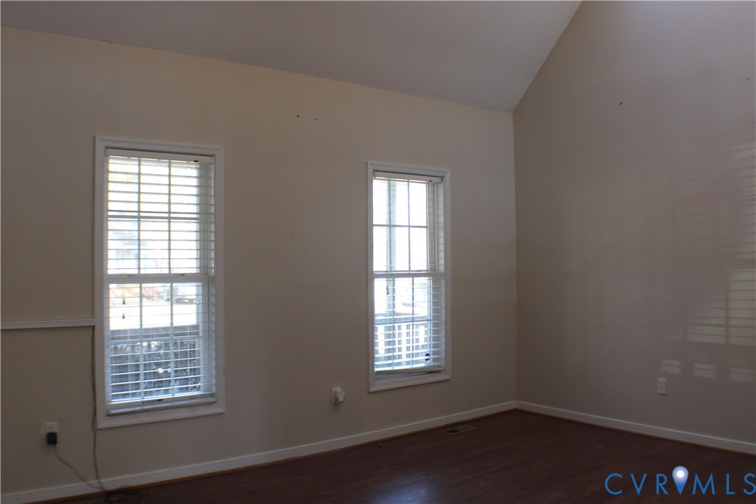 2929 South Ridge Drive Midlothian, VA 23112 - Photo 5 of 37 an empty room with wooden floor and windows