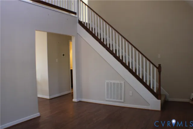 a view of a dining room with furniture and a window