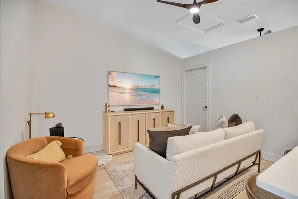 a bedroom with a bed and a tv