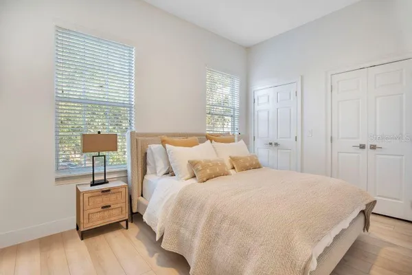 a bathroom with 2 sink and a mirror